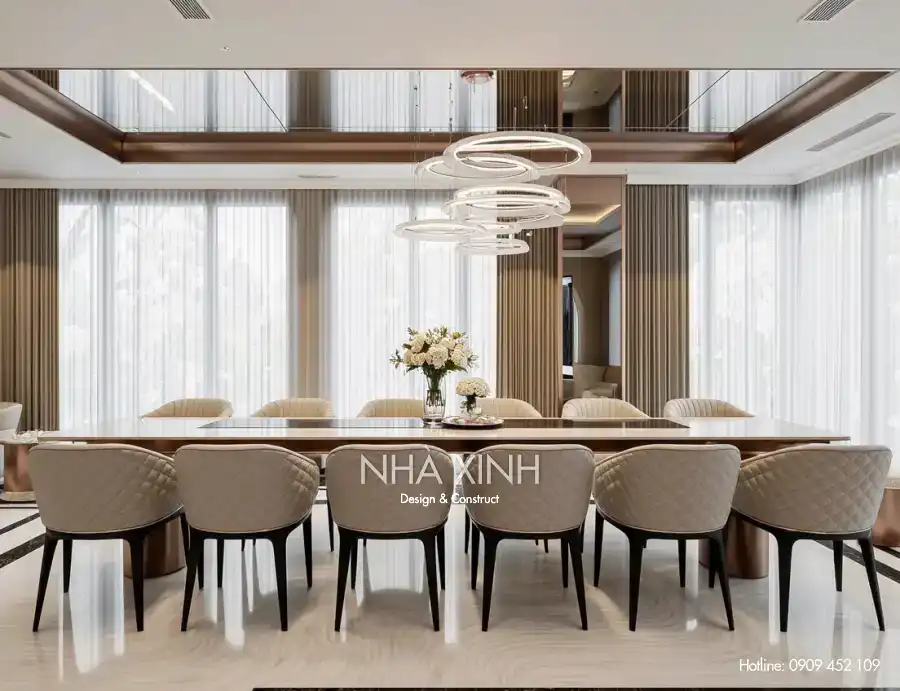 Phòng ăn biệt thự BT-0230 với bàn ăn lớn và ánh sáng ấm áp.