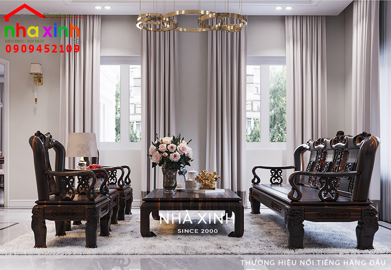 Bộ sofa bằng gỗ chạm khắc hoa văn tỉ mỉ là điểm nhấn trong không gian phòng khách